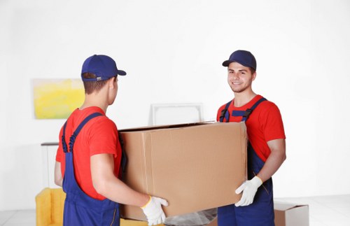 Removal team in Balham handling boxes and furniture during a house move