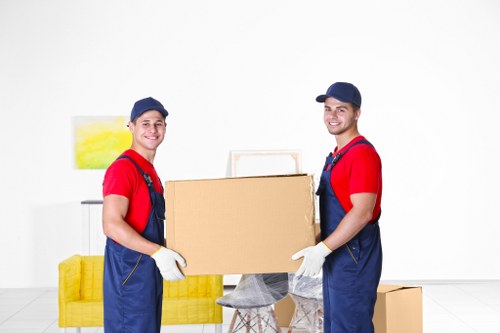 Specialist movers handling a piano removal in a Balham residential property