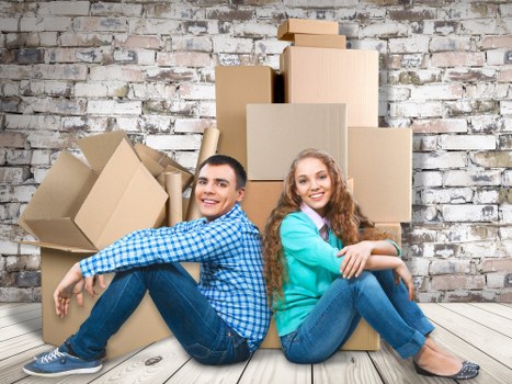 Moving team transporting desks and IT equipment during an office move in Balham