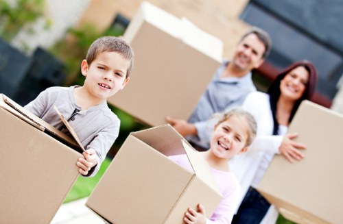 Office movers packing equipment and files for a Balham business move