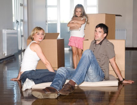Packed office boxes and furniture prepared for a Balham business move